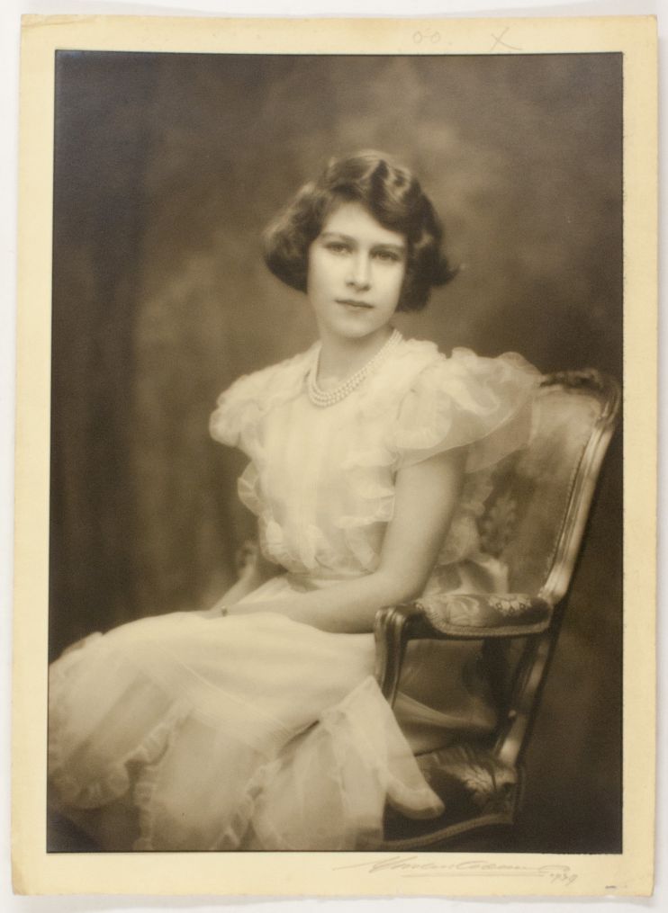 [ELIZABETH II — Charming photo by Marcus Adams signed and dated by the photographer in pencil and dated | Sophie Dupré Autographs