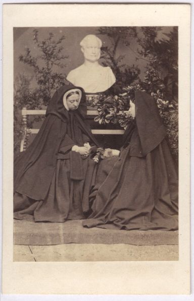 [VICTORIA — Fine Carte-de-visite Photograph showing them seated facing each other beneath Prince Albert's marble bust, | Sophie Dupré Autographs